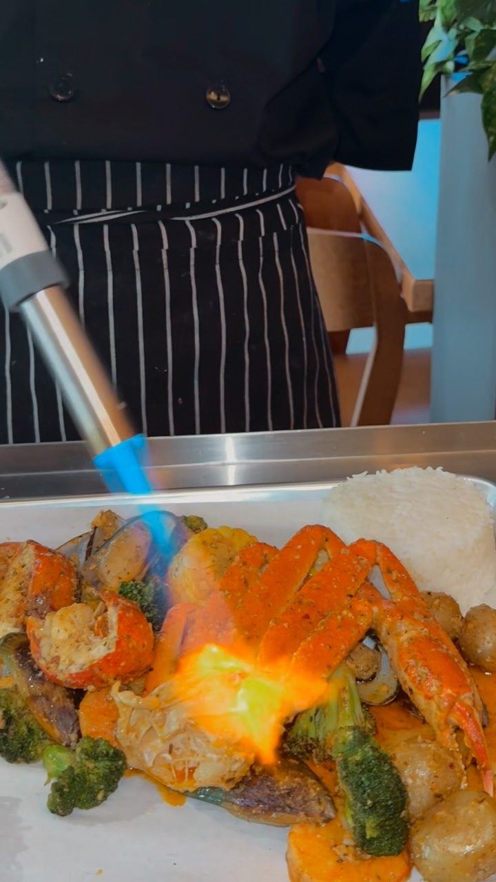 Reel cover: torch over seafood boil (low-res 720px)