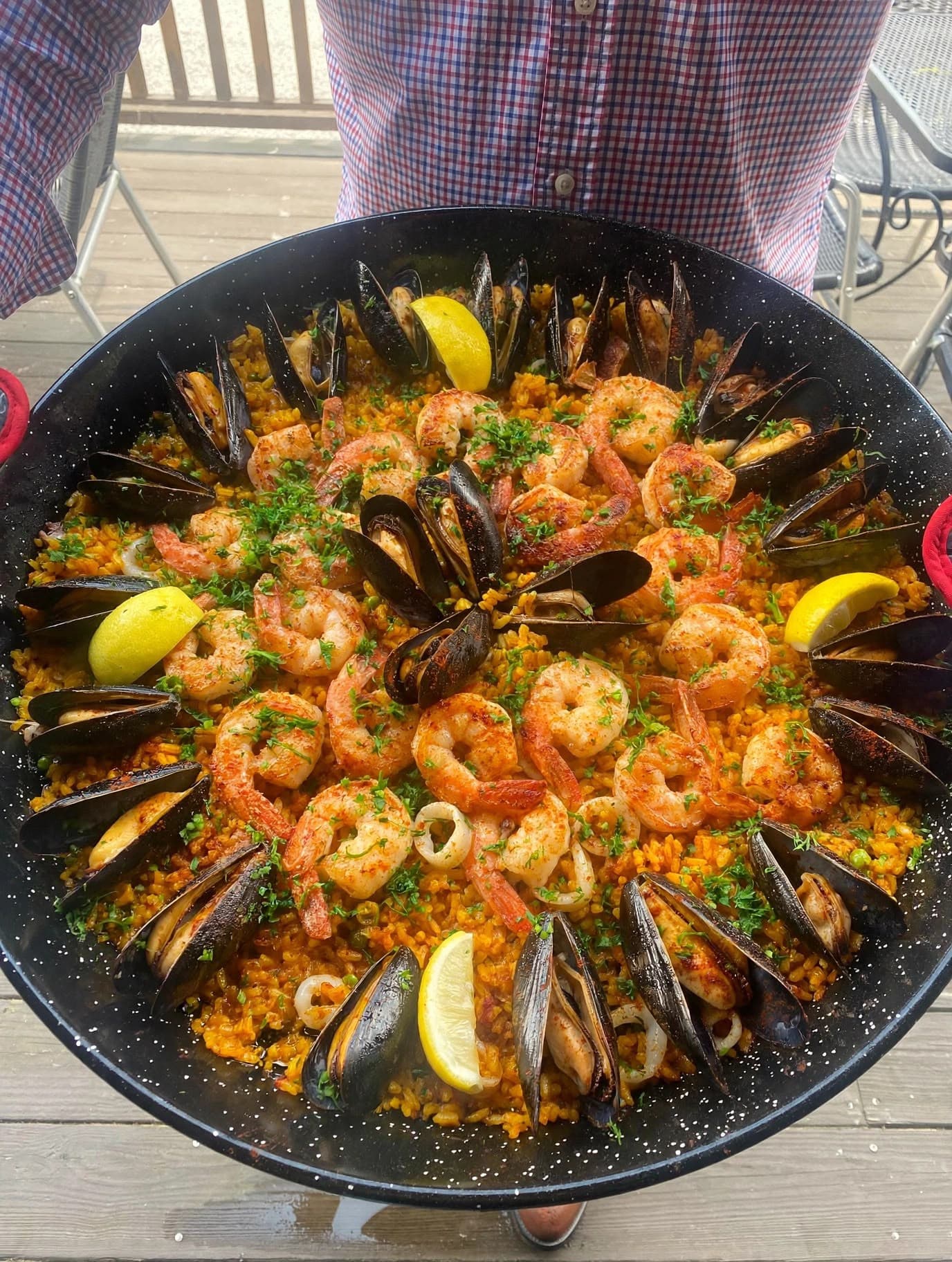 Seafood paella — mussels, shrimp, lemon