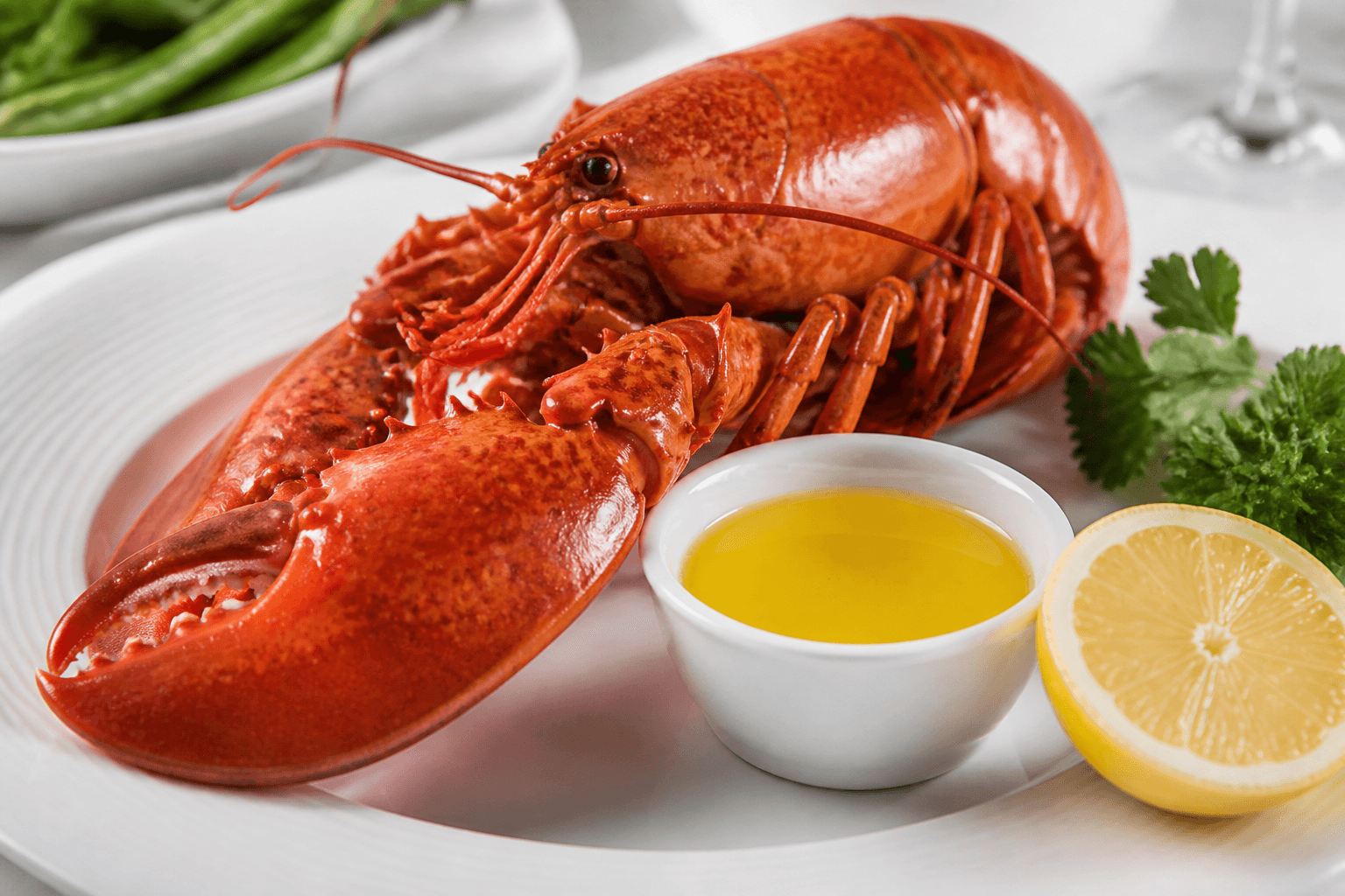 Cooked lobster with drawn butter, lemon, and herbs