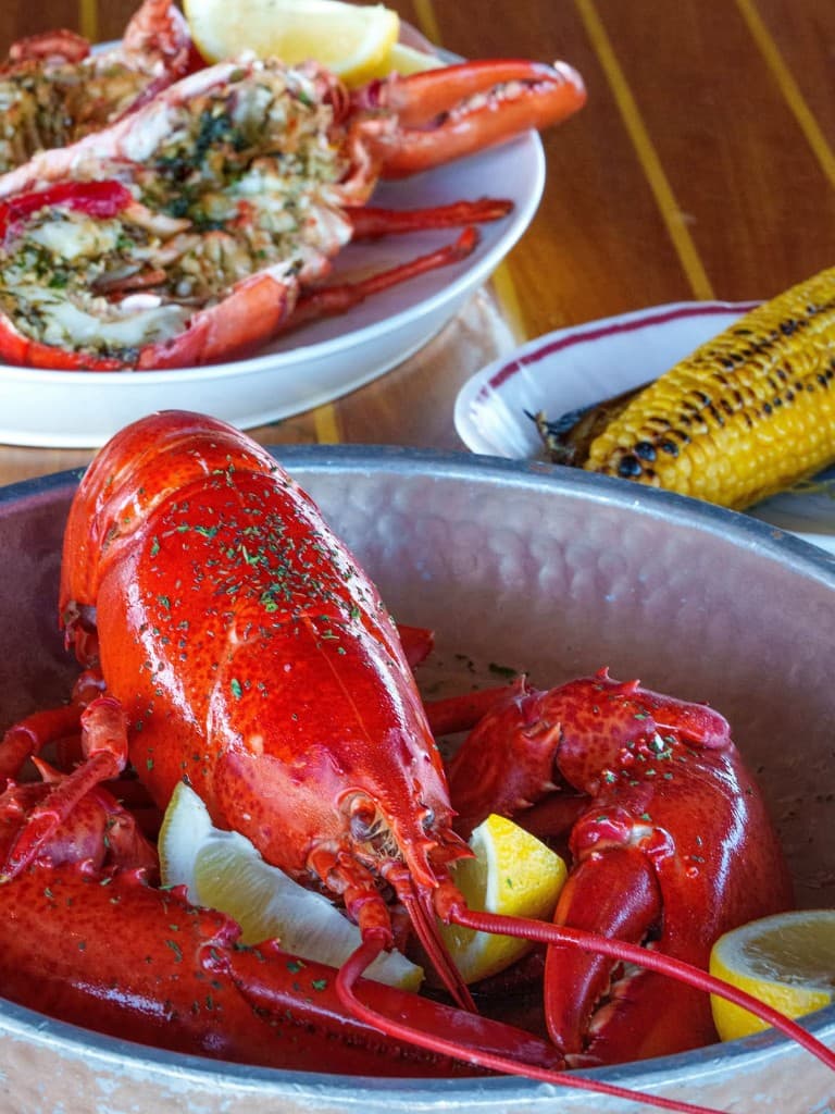 Whole lobster, grilled halves, corn
