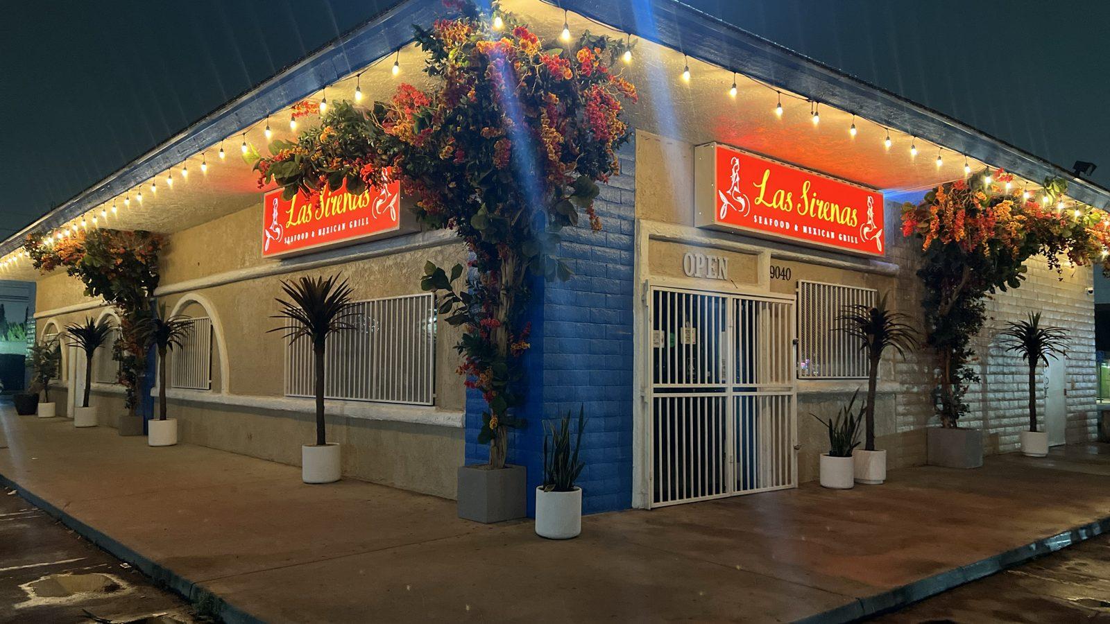 Mariscos Las Sirenas storefront on Slauson Ave at night