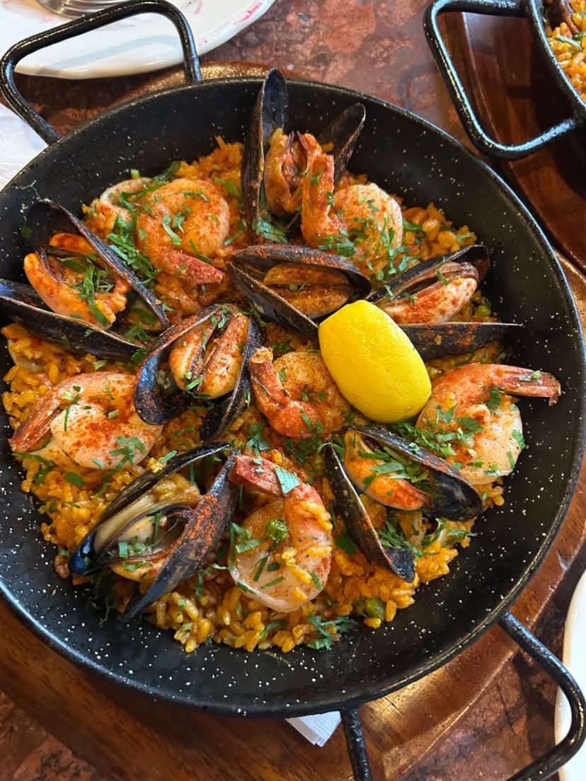 Overhead — mussels and shrimp on saffron rice