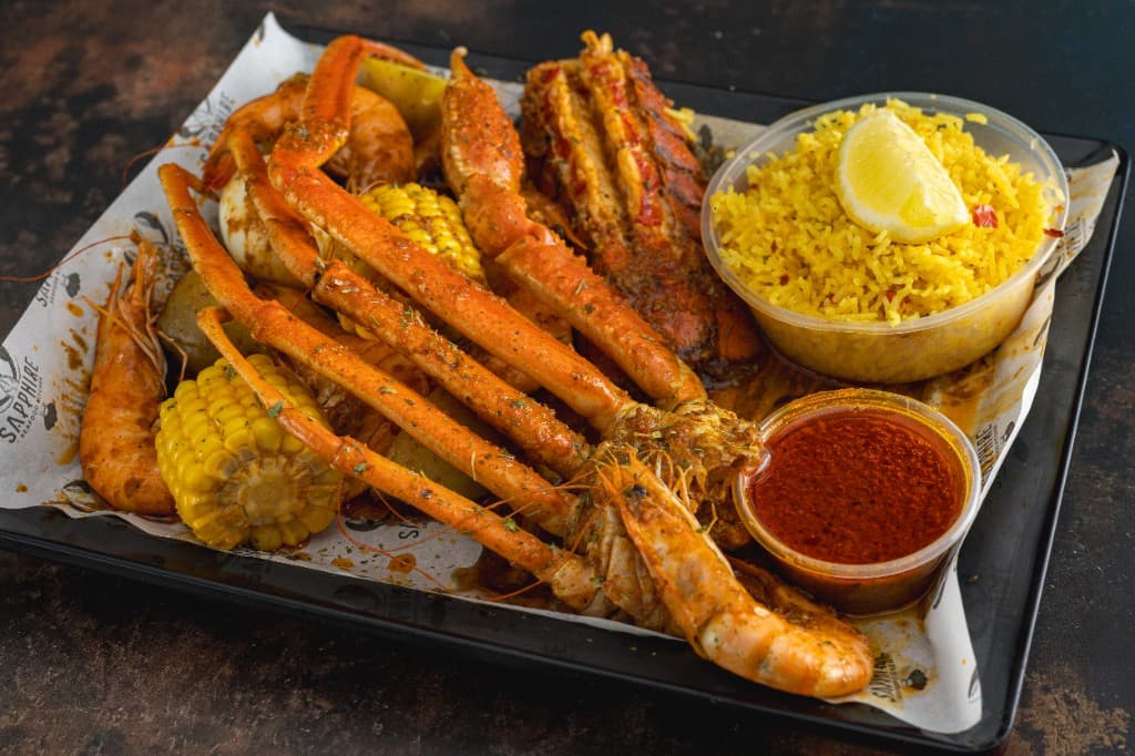 Snow crab legs and yellow rice, shot from above