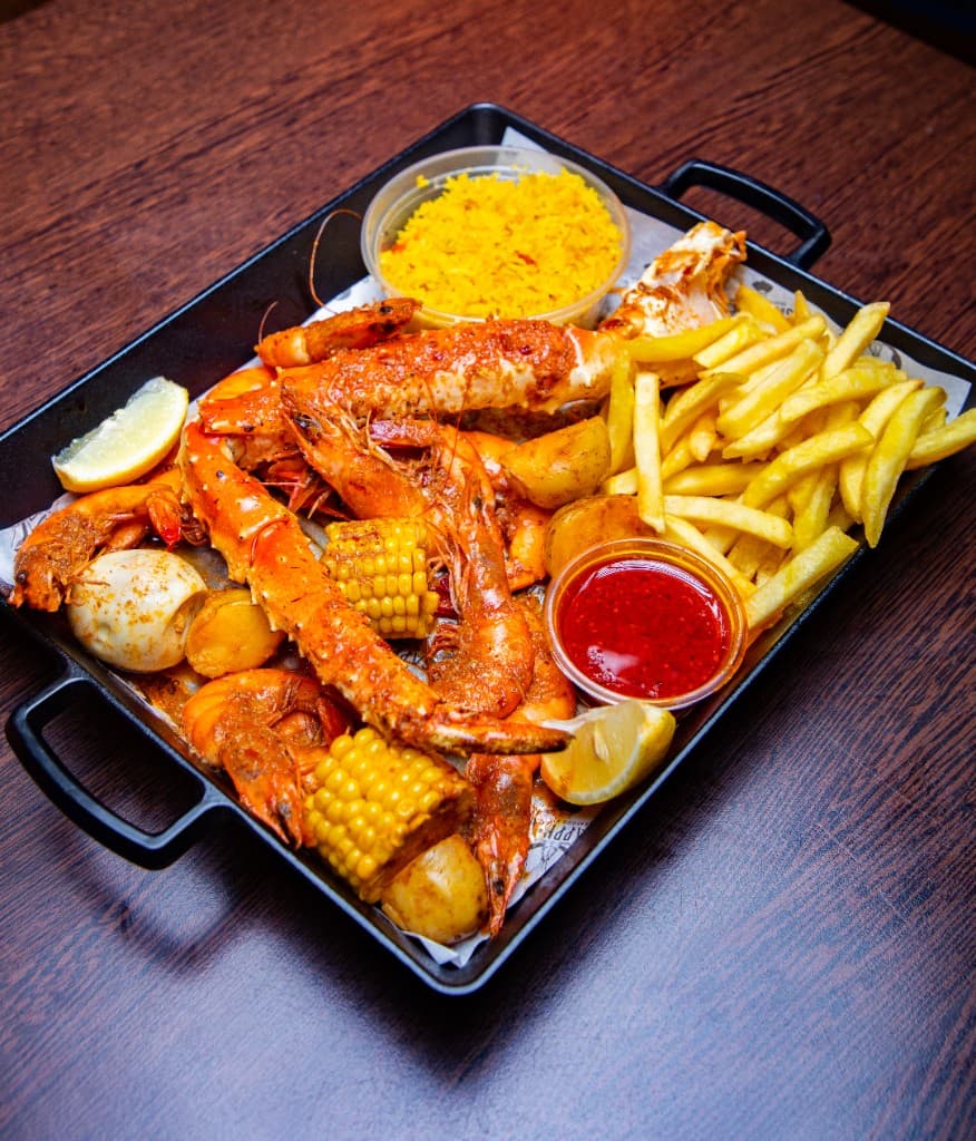King prawns, crab, fries, and yellow rice